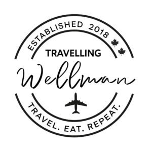 Travelling Wellman Logo